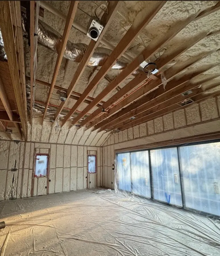 Interior walls and ceiling insulated with spray foam during new construction in Angola